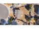 Aerial view of a home featuring a well-maintained lawn, mature trees, and a driveway with parking at 616 N Brentwood Ct, Castle Rock, CO 80104
