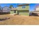 Backyard featuring a green home, a patio, and a firepit at 616 N Brentwood Ct, Castle Rock, CO 80104