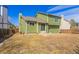Backyard featuring a green home and a patio at 616 N Brentwood Ct, Castle Rock, CO 80104