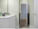 Bathroom featuring new vanity and sink with a laundry area through the door at 616 N Brentwood Ct, Castle Rock, CO 80104