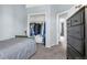 Bedroom featuring a small bed with a closet and dresser next to the hall entrance at 616 N Brentwood Ct, Castle Rock, CO 80104