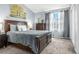 Bedroom featuring a bed with wood frame, soft gray carpet and lots of natural light at 616 N Brentwood Ct, Castle Rock, CO 80104