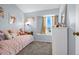 Bedroom featuring a bed with a small window, soft carpet and blue walls at 616 N Brentwood Ct, Castle Rock, CO 80104