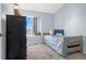Bedroom featuring a small bed and soft carpet, with neutral colored walls and natural light at 616 N Brentwood Ct, Castle Rock, CO 80104