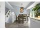 Dining area with backyard view, chandelier, and access to the kitchen, perfect for entertaining at 616 N Brentwood Ct, Castle Rock, CO 80104