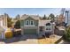 Charming two-story home with a lovely green exterior, a well-maintained lawn, and an attached garage at 616 N Brentwood Ct, Castle Rock, CO 80104