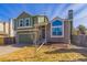 Charming two-story home with an attached two-car garage, a stone facade, and mature landscaping at 616 N Brentwood Ct, Castle Rock, CO 80104