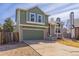 Lovely two-story home with a green garage door and front door, complemented by the driveway at 616 N Brentwood Ct, Castle Rock, CO 80104