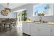 Bright kitchen featuring modern appliances, a sink overlooking the garden, and ample countertop space at 616 N Brentwood Ct, Castle Rock, CO 80104
