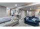 Finished basement with wet bar and comfortable seating at 3912 Trail Stone Cir, Castle Rock, CO 80108