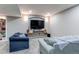 Finished basement Gathering room with two couches and a TV at 3912 Trail Stone Cir, Castle Rock, CO 80108