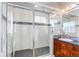Elegant bathroom with a walk-in shower, tiled walls, and modern vanity at 3912 Trail Stone Cir, Castle Rock, CO 80108