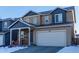 Two-story home with attached garage and stone accents at 3912 Trail Stone Cir, Castle Rock, CO 80108