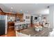 Open kitchen with an island, hardwood floors, and ample cabinetry at 3912 Trail Stone Cir, Castle Rock, CO 80108