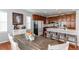 Eat-in kitchen with hardwood floors, and an island with seating at 3912 Trail Stone Cir, Castle Rock, CO 80108