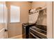 Bright laundry room, featuring washer, dryer, and storage at 3912 Trail Stone Cir, Castle Rock, CO 80108