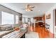 Open living room with hardwood floors, a view of the kitchen, and ample natural light at 3912 Trail Stone Cir, Castle Rock, CO 80108