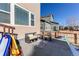 Small patio with seating area and partial snow cover at 3912 Trail Stone Cir, Castle Rock, CO 80108