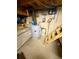 Basement mechanical room featuring water tank and stairs at 33606 Gap Rd, Golden, CO 80403