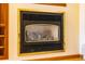 A fireplace built into the wall of a living room area at 33606 Gap Rd, Golden, CO 80403