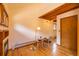 A living room area with hardwood floors, built-in shelves, and windows at 33606 Gap Rd, Golden, CO 80403