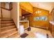 A living room area with hardwood floors, many windows, and an open kitchen concept at 33606 Gap Rd, Golden, CO 80403