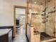 Bathroom featuring a walk-in shower, and a jacuzzi tub at 32663 Donna Dr, Conifer, CO 80433