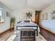 Comfortable bedroom featuring hardwood floors, area rug, and neutral decor at 32663 Donna Dr, Conifer, CO 80433