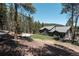 Well-maintained home with a spacious backyard and mature trees in a serene setting at 32663 Donna Dr, Conifer, CO 80433