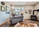 Stylish home office with a fireplace, desk, decor, and ample lighting at 32663 Donna Dr, Conifer, CO 80433