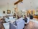 Open-concept living space with a view of the kitchen, dining area, and stairs at 32663 Donna Dr, Conifer, CO 80433
