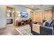 Cozy entertainment space with TV, storage shelving, and plush seating at 32663 Donna Dr, Conifer, CO 80433