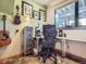 Modern office space featuring a comfortable chair, desk, and natural light at 32663 Donna Dr, Conifer, CO 80433