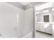 Bright bathroom featuring a tub with white tiling and a vanity with modern light fixtures at 27534 E Byers Ave, Aurora, CO 80018