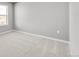 Neutral bedroom with light carpet, a window and modern electrical outlets at 27534 E Byers Ave, Aurora, CO 80018