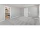 Spacious bedroom has an ensuite bathroom and neutral carpeting, creating a cozy retreat at 27534 E Byers Ave, Aurora, CO 80018