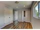 Cozy bedroom with hardwood floors, ample closet space, and a bright window offering natural light and neighborhood views at 3769 Dahlia St, Denver, CO 80207