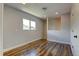 This bedroom has hardwood floors, neutral paint, and plenty of natural light at 3769 Dahlia St, Denver, CO 80207