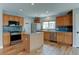 Well-equipped kitchen with stainless steel appliances, ample cabinet space, and a convenient center island for food preparation at 3769 Dahlia St, Denver, CO 80207