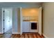 Laundry area with bi-fold doors housing modern washer and dryer, and wood-look flooring at 3769 Dahlia St, Denver, CO 80207