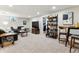 A cozy finished basement features comfortable seating, neutral carpet, and modern fixtures for a relaxing atmosphere at 794 S Ivy St, Denver, CO 80224