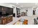 Inviting basement featuring stylish furniture, decor, and carpeted flooring perfect for entertaining at 794 S Ivy St, Denver, CO 80224