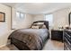 Comfortable bedroom featuring carpet, a double window, and closet offering ample storage at 794 S Ivy St, Denver, CO 80224