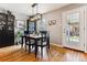 Stylish dining room features hardwood floors, modern furniture, and a bright, open layout perfect for relaxing and entertaining at 794 S Ivy St, Denver, CO 80224