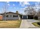Charming single Gathering home featuring a brick exterior, attached garage and a well-manicured front yard at 794 S Ivy St, Denver, CO 80224