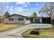 Charming single Gathering home featuring a brick exterior, attached garage and a well-manicured front yard at 794 S Ivy St, Denver, CO 80224