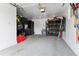 Functional garage with storage, shelving, an epoxy floor and work space, ideal for projects at 794 S Ivy St, Denver, CO 80224