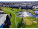Beautiful aerial view of the community golf course with walking path and sunny pond at 725 S Clinton St # 1B, Denver, CO 80247