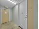 Common hallway showcasing unit doors and exit access, painted with neutral colors and ready for personalization at 725 S Clinton St # 1B, Denver, CO 80247