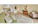Spacious living room with wood floors, comfy seating, and seamless flow into dining, ideal for entertaining at 725 S Clinton St # 1B, Denver, CO 80247